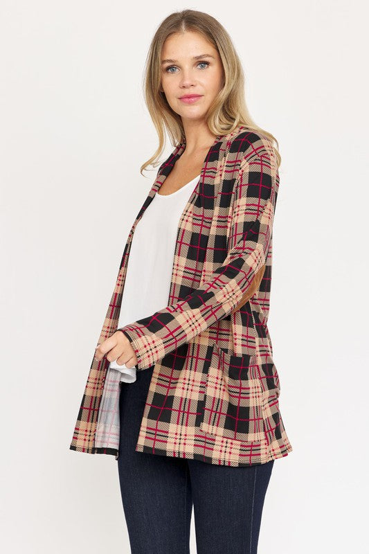 A woman with long blonde hair wears a Plaid Contrast Elbow Patch Cardigan over a white top and dark jeans, standing against a plain background.