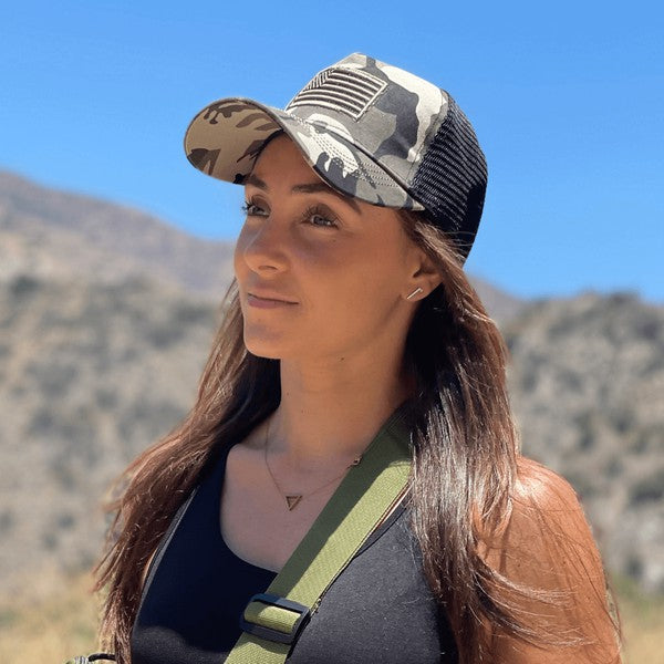 American Flag Unisex Trucker Hat with a navy blue front panel and breathable mesh back panel, perfect for outdoor activities.