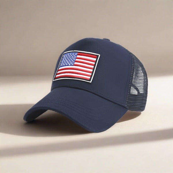 American Flag Unisex Trucker Hat with a navy blue front panel and breathable mesh back panel, perfect for outdoor activities.