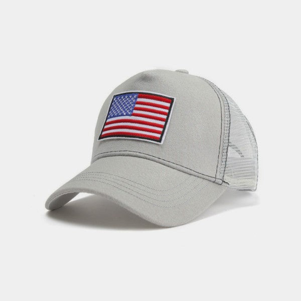 American Flag Unisex Trucker Hat with a navy blue front panel and breathable mesh back panel, perfect for outdoor activities.
