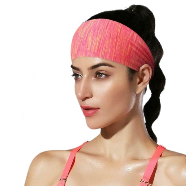 Woman with an Extra-Wide Sport Headband against a blue wall.