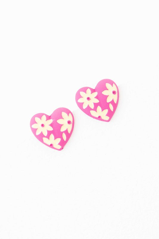 A diagonal line of Flower Lover Stud Earrings with floral patterns on a white background, featuring yellow stud hearts with Sterling Silver Posts.
