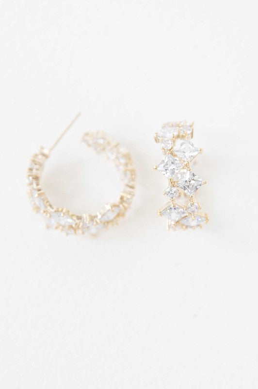 A pair of Carraway Hoop Earrings on a white background.