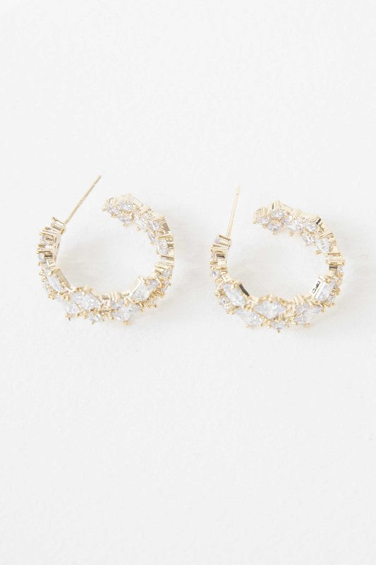 A pair of Carraway Hoop Earrings on a white background.