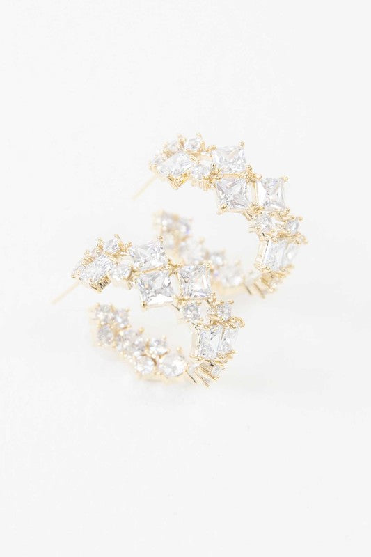 A pair of Carraway Hoop Earrings on a white background.