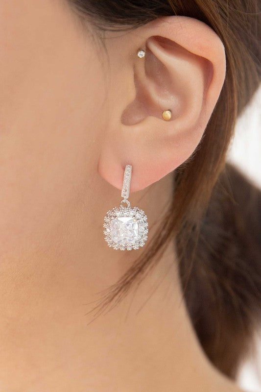 Pair of sterling silver Soigne Drop Earrings with sparkling cushion-cut and pave halo settings.