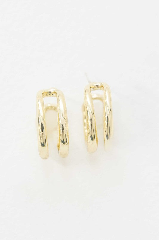 Stack of Duple Hoop Earrings on a white background.