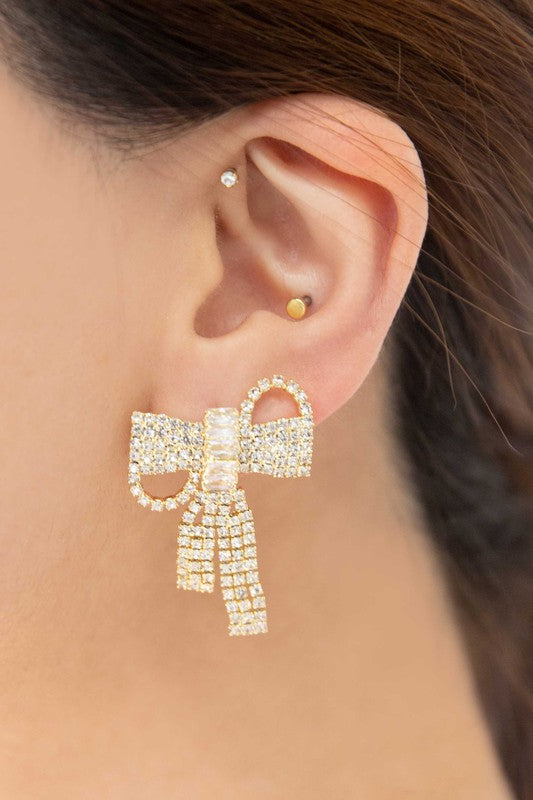 Pair of Crystal Bow Earrings on a plain background.