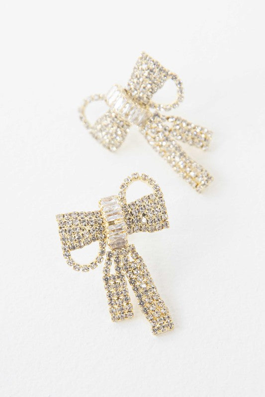 Pair of Crystal Bow Earrings on a plain background.