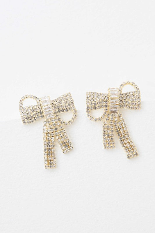 Pair of Crystal Bow Earrings on a plain background.
