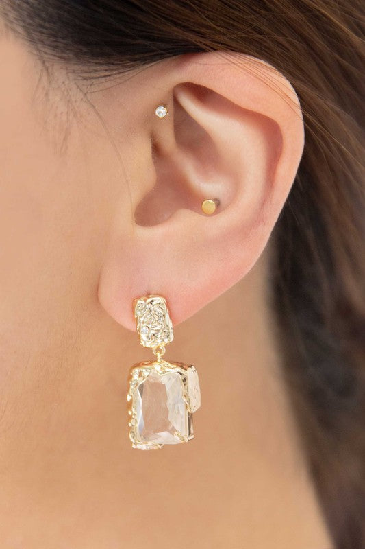 Molten Drop Earrings with clear rectangular gemstones in a formal style.