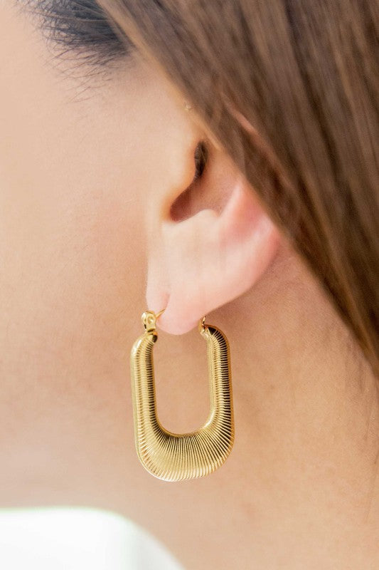 Nomad Hoop Earrings with a grooved texture on a white background.