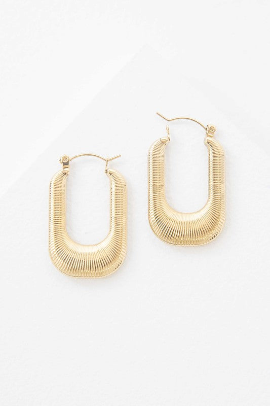 Nomad Hoop Earrings with a grooved texture on a white background.