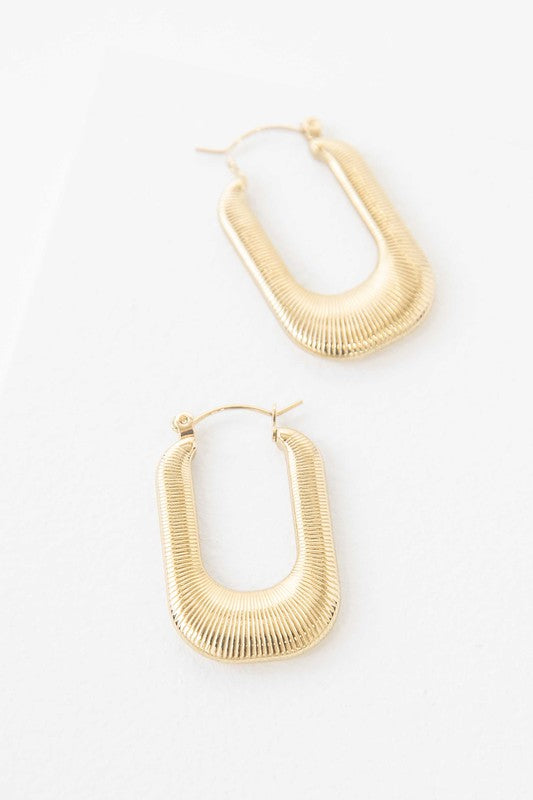 Nomad Hoop Earrings with a grooved texture on a white background.