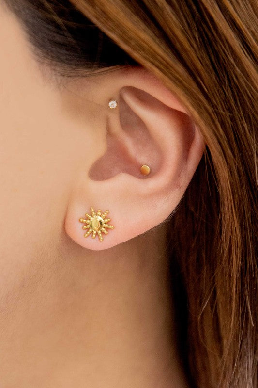 Pair of Sunnyside stud earrings with 14k gold plating on a white background.