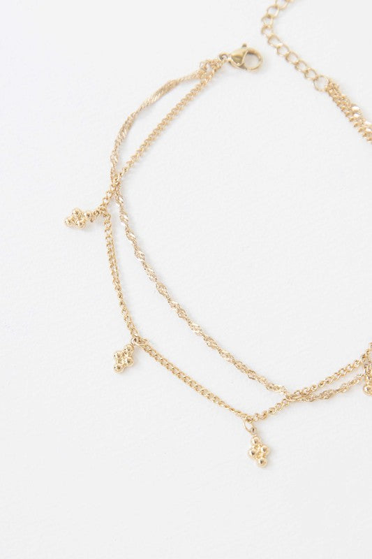 Double-layered Bon Bon Anklet with 14k gold plating and butterfly charms.