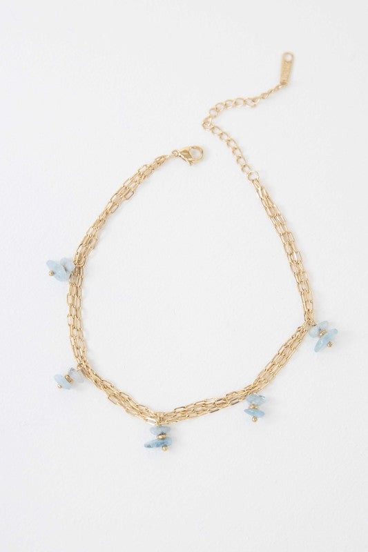 Stepping Stones Anklet with blue bead accents on a white background.