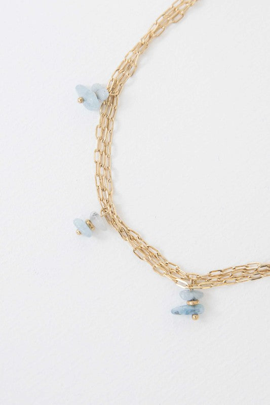 Stepping Stones Anklet with blue bead accents on a white background.