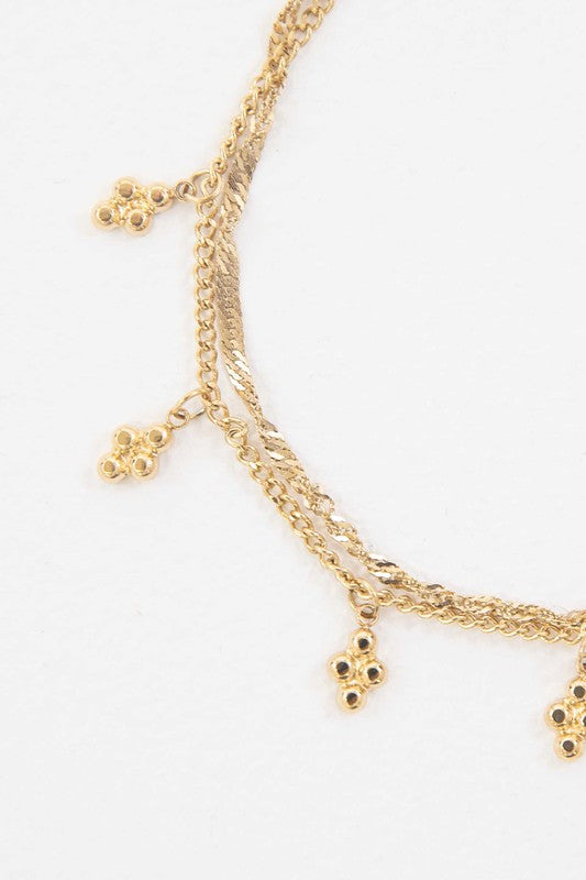 Bon Bon Bracelet with decorative charms and 14k gold plating.