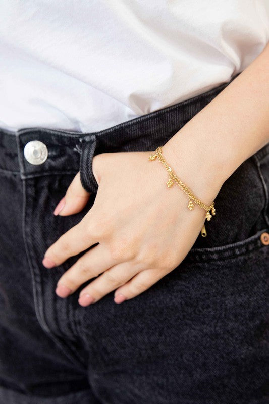 Bon Bon Bracelet with decorative charms and 14k gold plating.