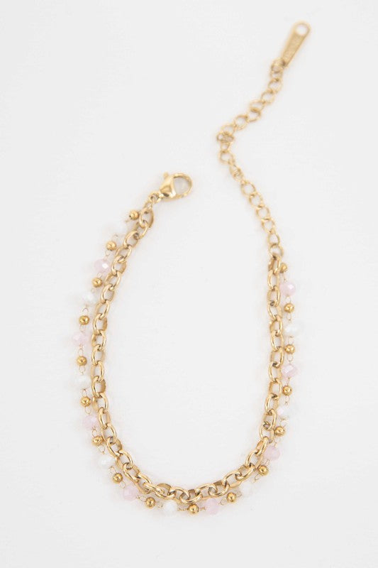 Caye Beaded Bracelet with pink bead embellishments on a white background, featuring 14k gold plating.