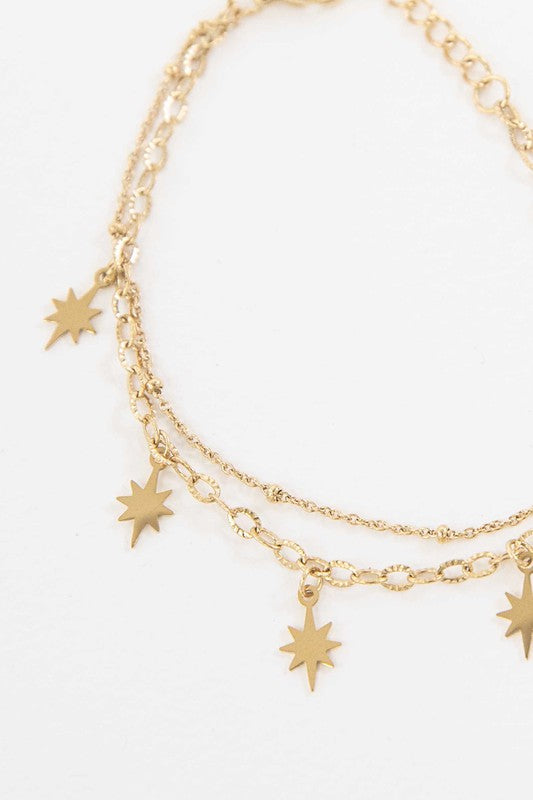 Sparks Bracelet with star charms and 14k gold plating.
