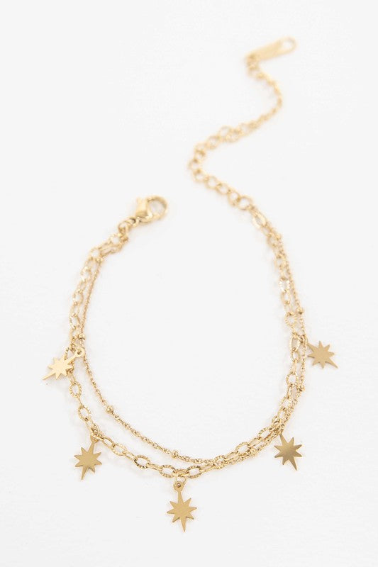 Sparks Bracelet with star charms and 14k gold plating.