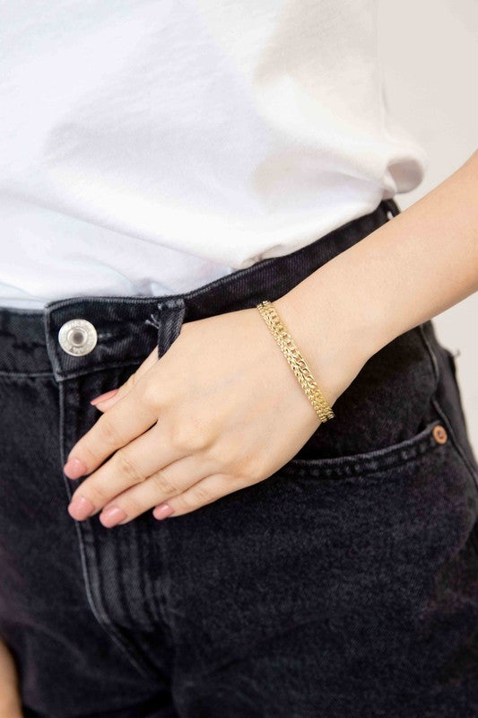 Two Sequenced Cuff Bracelets with stainless steel decorative patterns on a white background.