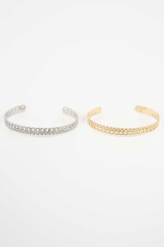 Two Sequenced Cuff Bracelets with stainless steel decorative patterns on a white background.