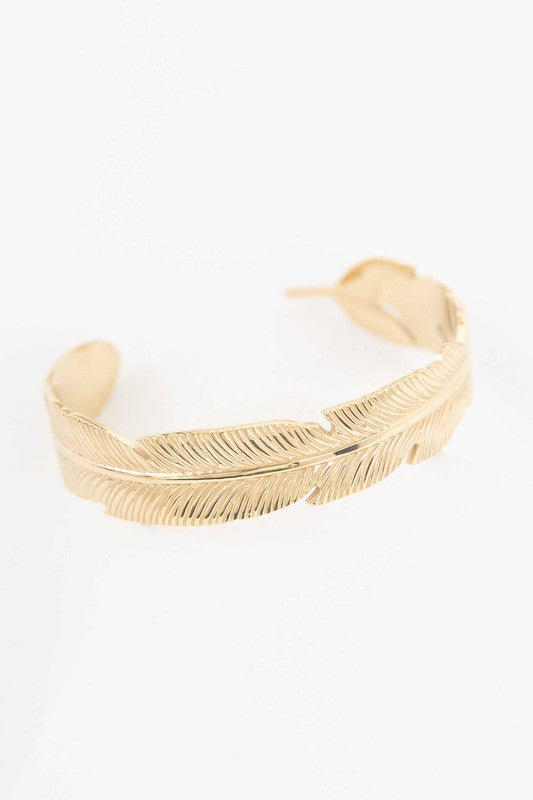Feather Cuff Bracelet with feather design and 14k gold plating on a white background.