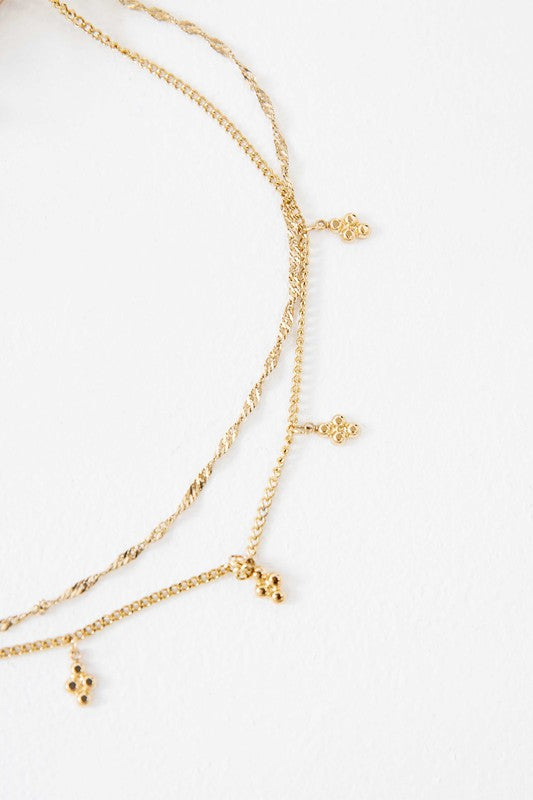 Bon Bon Layered Necklace with dangling charms displayed on a white background.