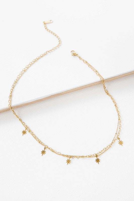 Sparks Layered Necklace with small star-shaped pendants on a white background.