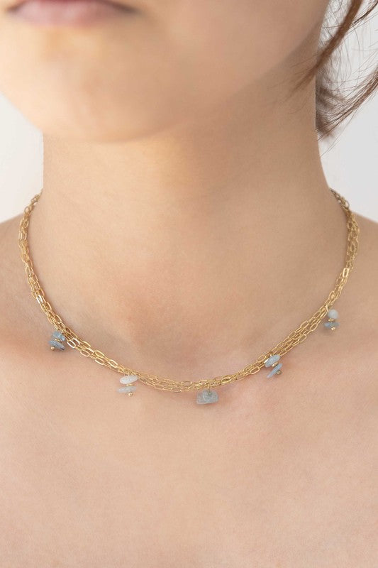 Stepping Stones Necklace with blue accent beads and 14k gold plating.