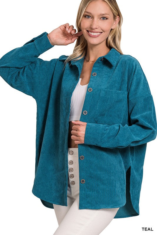 A woman smiling and wearing the Oversize Corduroy Shacket in teal over a white top, perfect for casual outings in your fall and winter wardrobe.