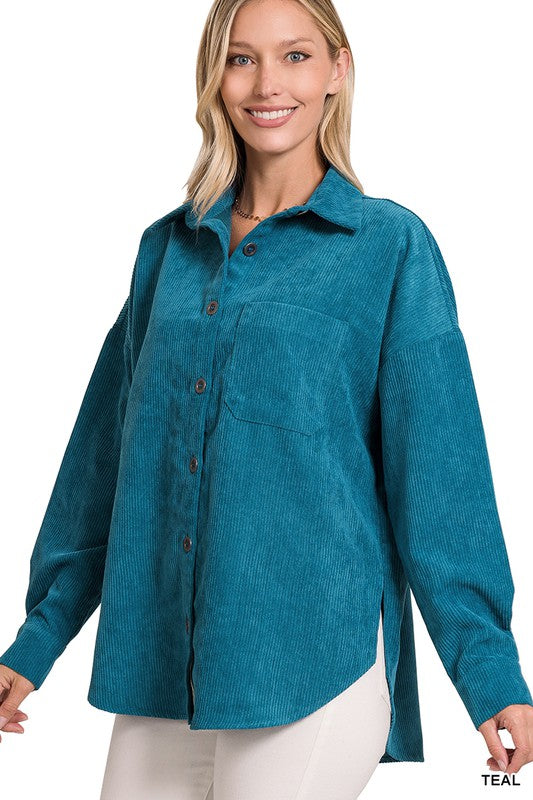 A woman smiling and wearing the Oversize Corduroy Shacket in teal over a white top, perfect for casual outings in your fall and winter wardrobe.