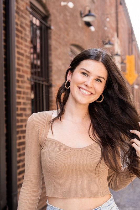 Pair of lightweight Camy Hoops - Brown Dot acrylic earrings with clear backings displayed on a white dish.