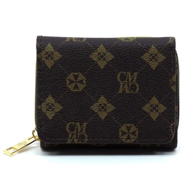 A CM Monogram Tri-fold Wallet, crafted from vegan leather, featuring a black design with a gold zipper and intricate geometric patterns, including star shapes and "CM" monogram lettering.