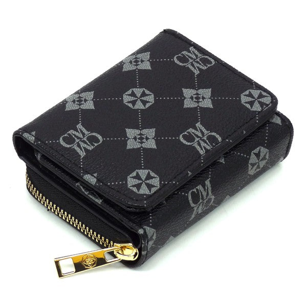 A CM Monogram Tri-fold Wallet, crafted from vegan leather, featuring a black design with a gold zipper and intricate geometric patterns, including star shapes and "CM" monogram lettering.