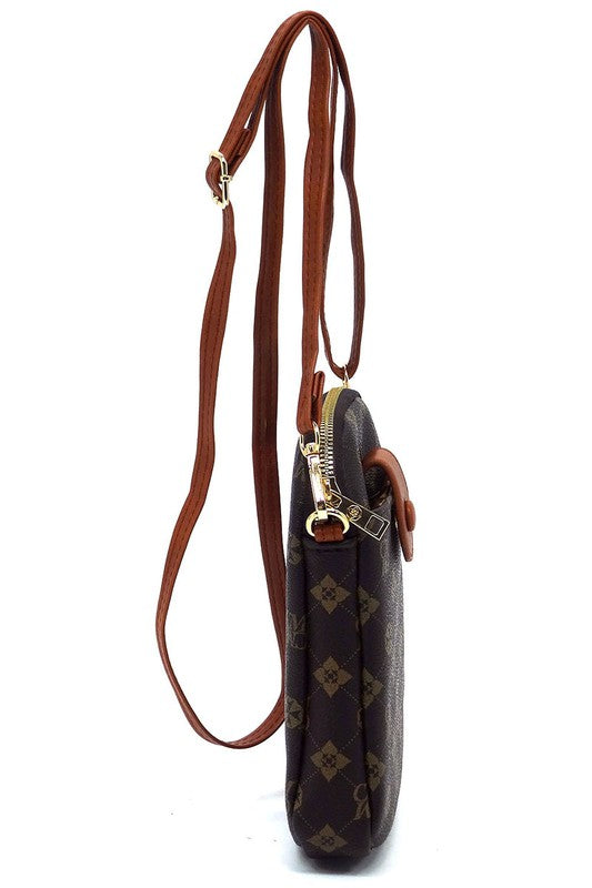The CM Monogram Mini Crossbody Bag Cell Phone Purse is a small, black patterned crossbody bag made from faux vegan leather, featuring a front buttoned flap, gold-tone hardware, and a detachable strap.