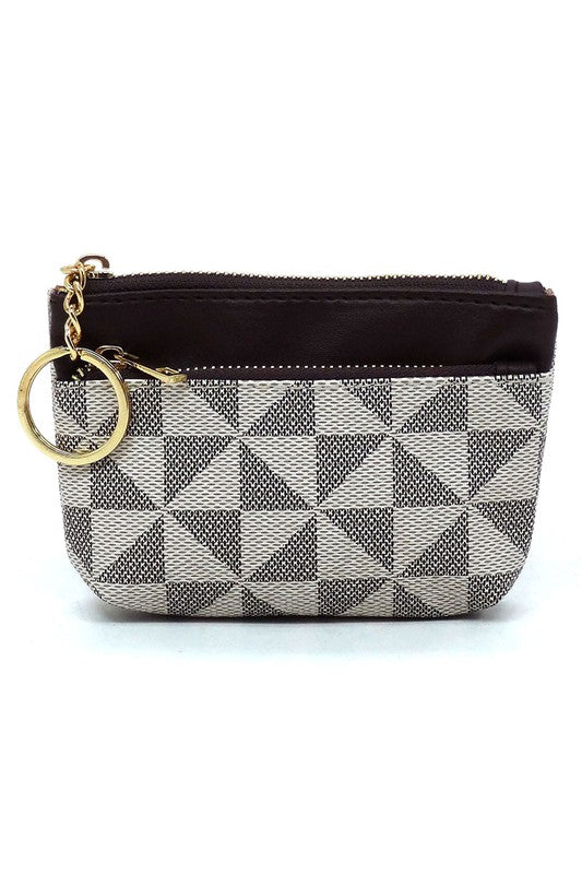 A small clutch bag made of faux vegan leather, featuring a black and white geometric pattern, a gold zipper, and adorned with the PM Monogram Keychain Coin Purse attached on the left side.