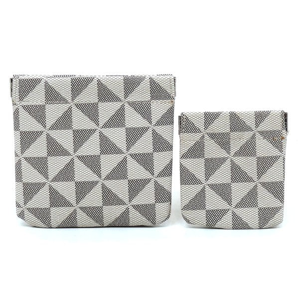 The PM Monogram Spring Zip 2-in-1 Coin Purse includes two fabric bags, one larger and one smaller, adorned with a black and white geometric triangle pattern. These bags feature a convenient spring zip closure and gold-tone hardware for an elegant finish.