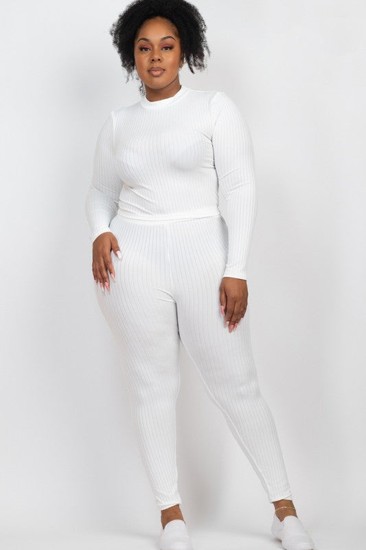 A person is wearing a Plus Ribbed Mock Neck Long Sleeve Top&Leggings Set in burgundy, paired with white shoes, standing against a plain white background.