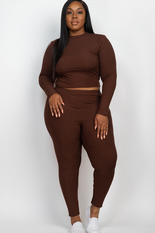 A person is wearing a Plus Ribbed Mock Neck Long Sleeve Top&Leggings Set in burgundy, paired with white shoes, standing against a plain white background.