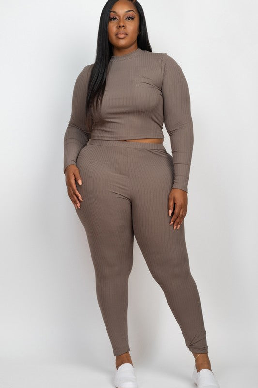 A person is wearing a Plus Ribbed Mock Neck Long Sleeve Top&Leggings Set in burgundy, paired with white shoes, standing against a plain white background.