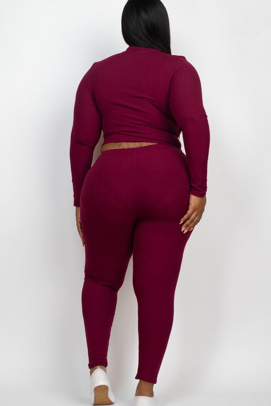 A person is wearing a Plus Ribbed Mock Neck Long Sleeve Top&Leggings Set in burgundy, paired with white shoes, standing against a plain white background.