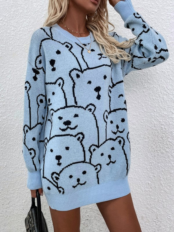 A person wearing a Womens Long Sleeve Round Neck Pullover Sweater adorned with multiple bear faces stands against a white textured wall.