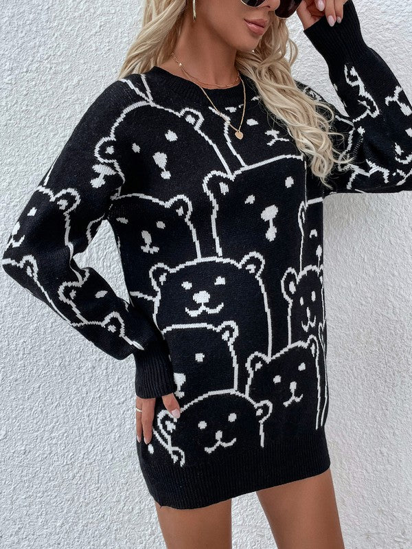 A person wearing a Womens Long Sleeve Round Neck Pullover Sweater adorned with multiple bear faces stands against a white textured wall.