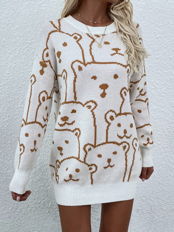 A person wearing a Womens Long Sleeve Round Neck Pullover Sweater adorned with multiple bear faces stands against a white textured wall.