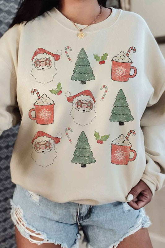 Person wearing the CHRISTMAS COLLECTION GRAPHIC SWEATSHIRT in light gray, featuring festive prints of Santa faces, hot cocoa mugs, Christmas trees, and candy canes, paired with denim shorts.