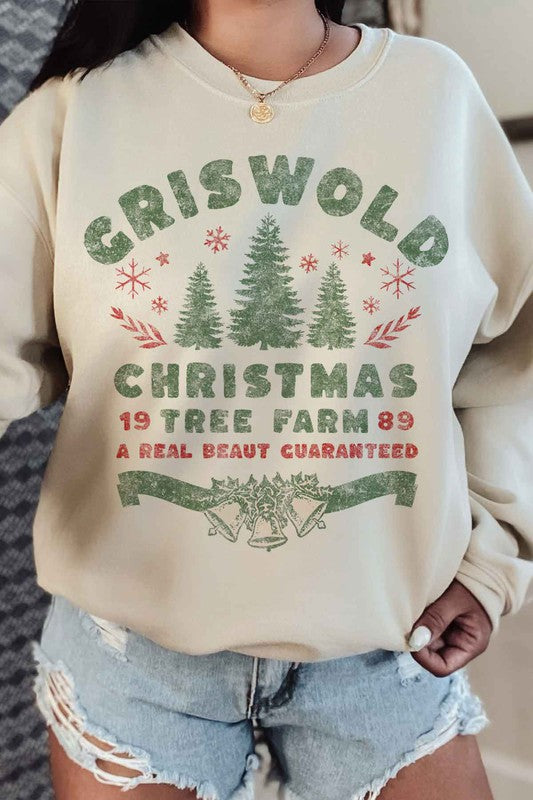 Person wearing a cozy CHRISTMAS TREE FARM GRAPHIC PLUS SIZE SWEATSHIRT in white, adorned with green and red text: "Griswold Christmas Tree Farm '89, A Real Beaut Guaranteed," showcasing festive Christmas trees and holiday decorations. Perfect for a charming visit to the Christmas tree farm!